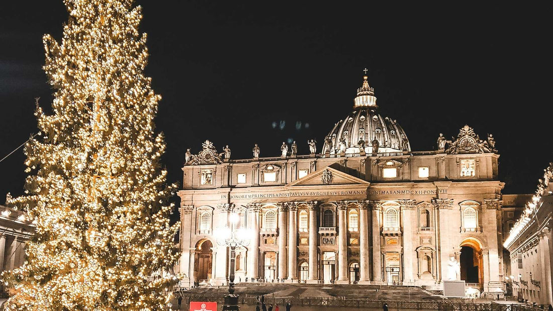 vatican city with lights on with christmas tree in front in european winter
