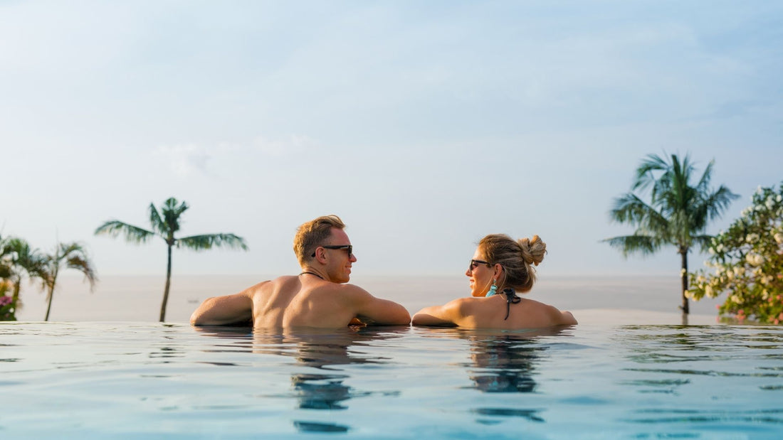 couple in a pool in a budget friendly honeymoon destination