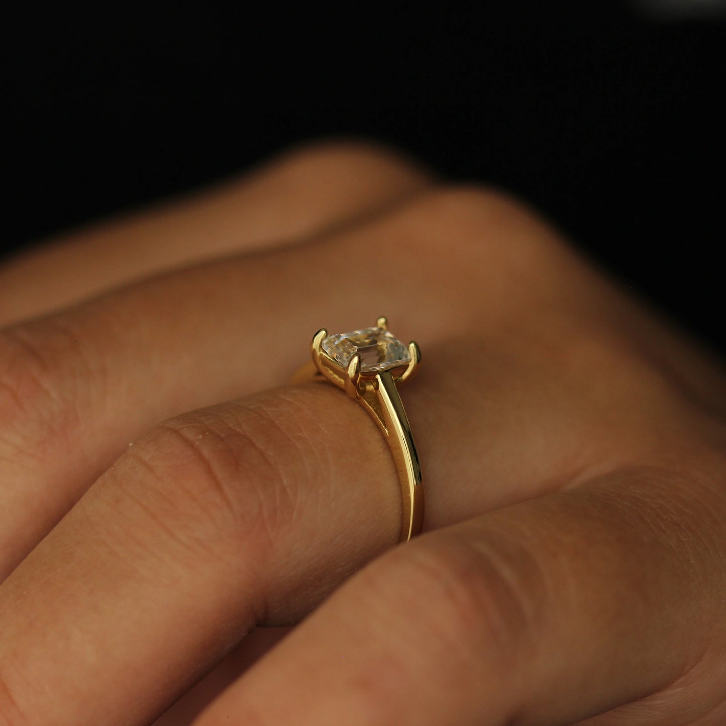 1 carat emerald cut CZ solitaire ring in gold