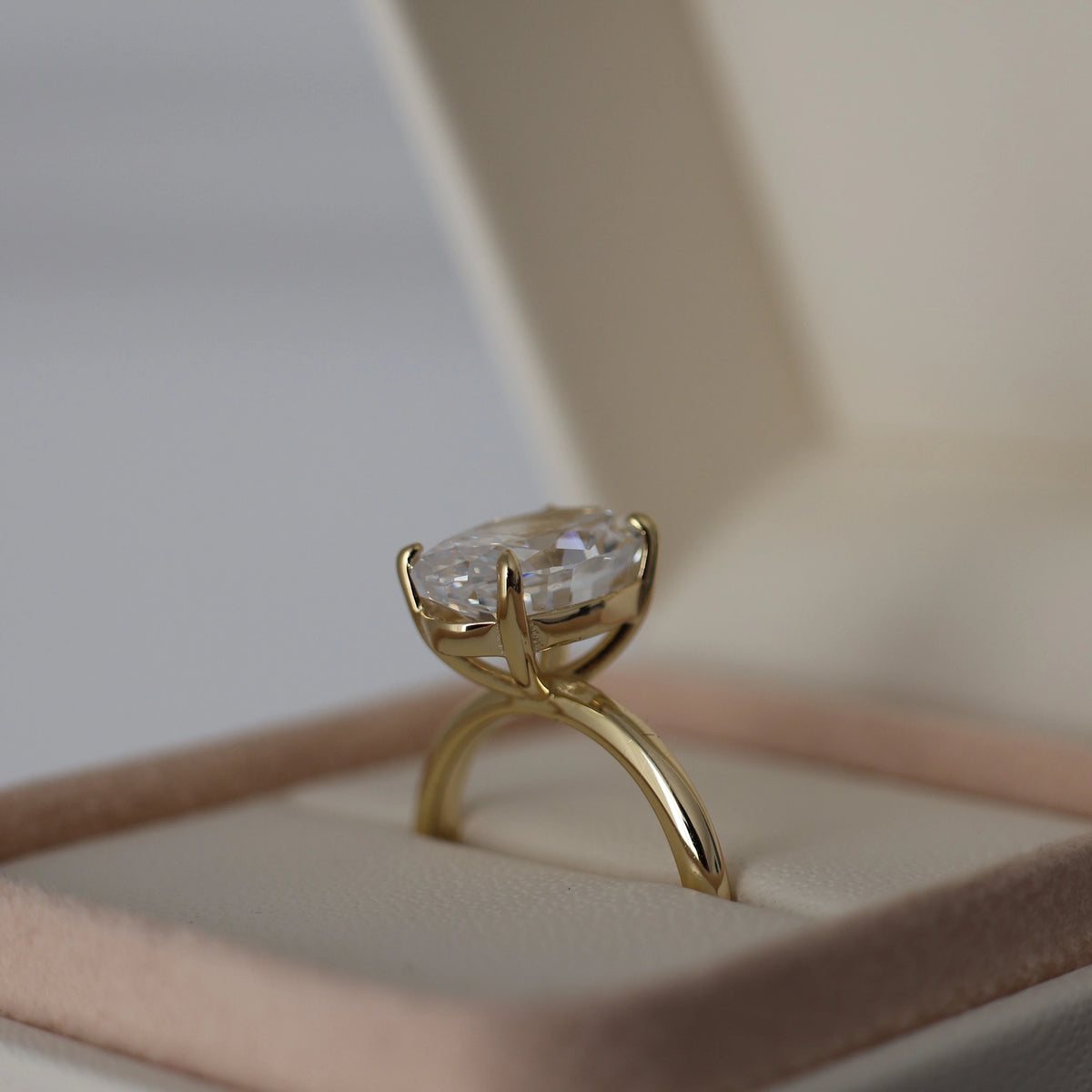 14k gold plated 3.5 ct oval cut cubic zirconia ring displayed in a proposal box