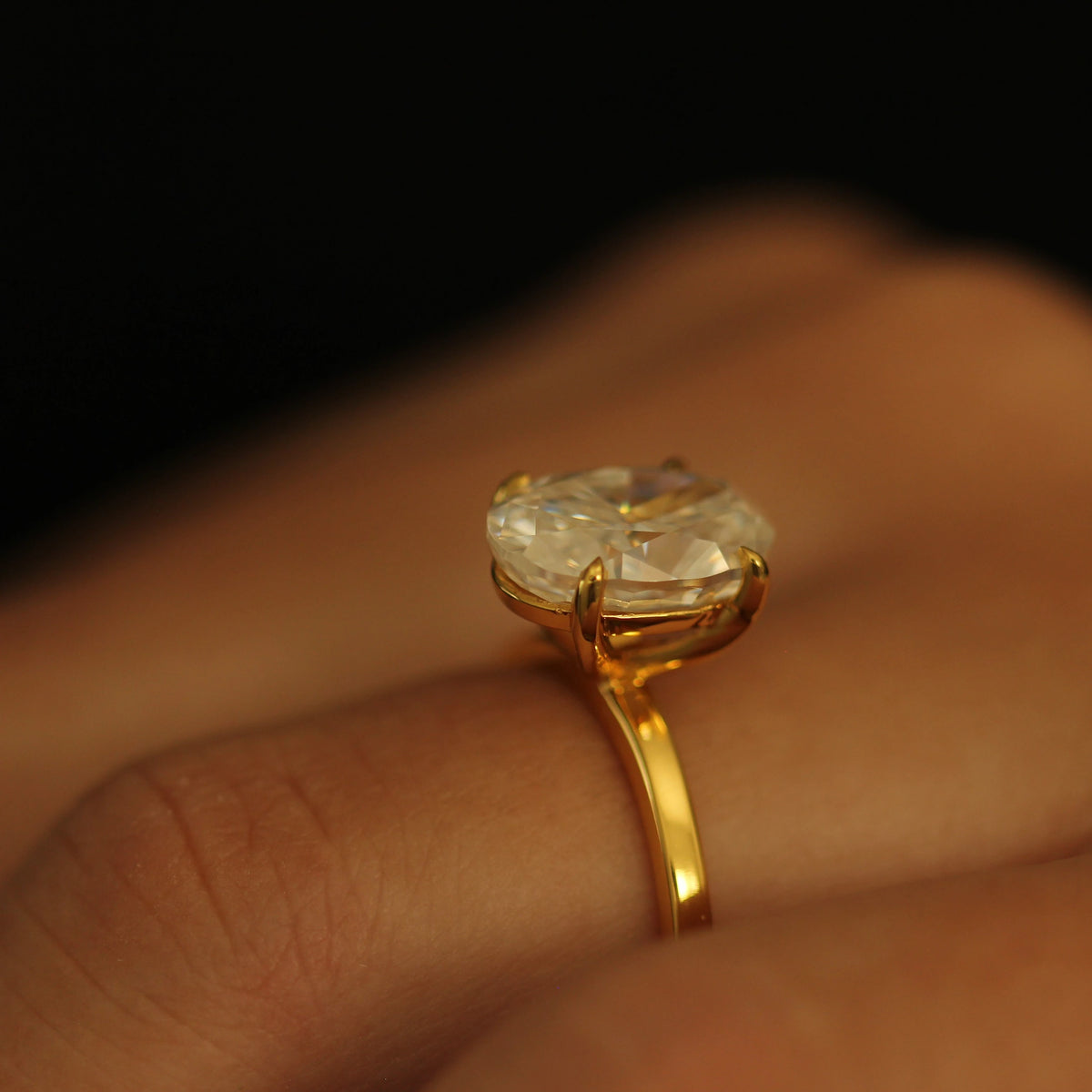 Close up of 18k gold filled 4 carat oval moissanite ring