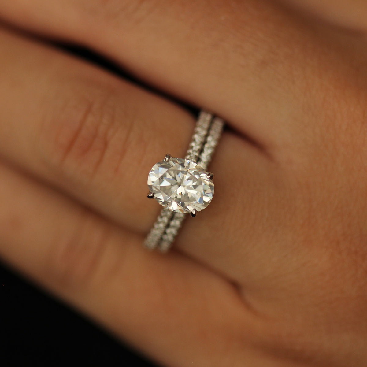 2 carat oval moissanite engagement ring with pave band