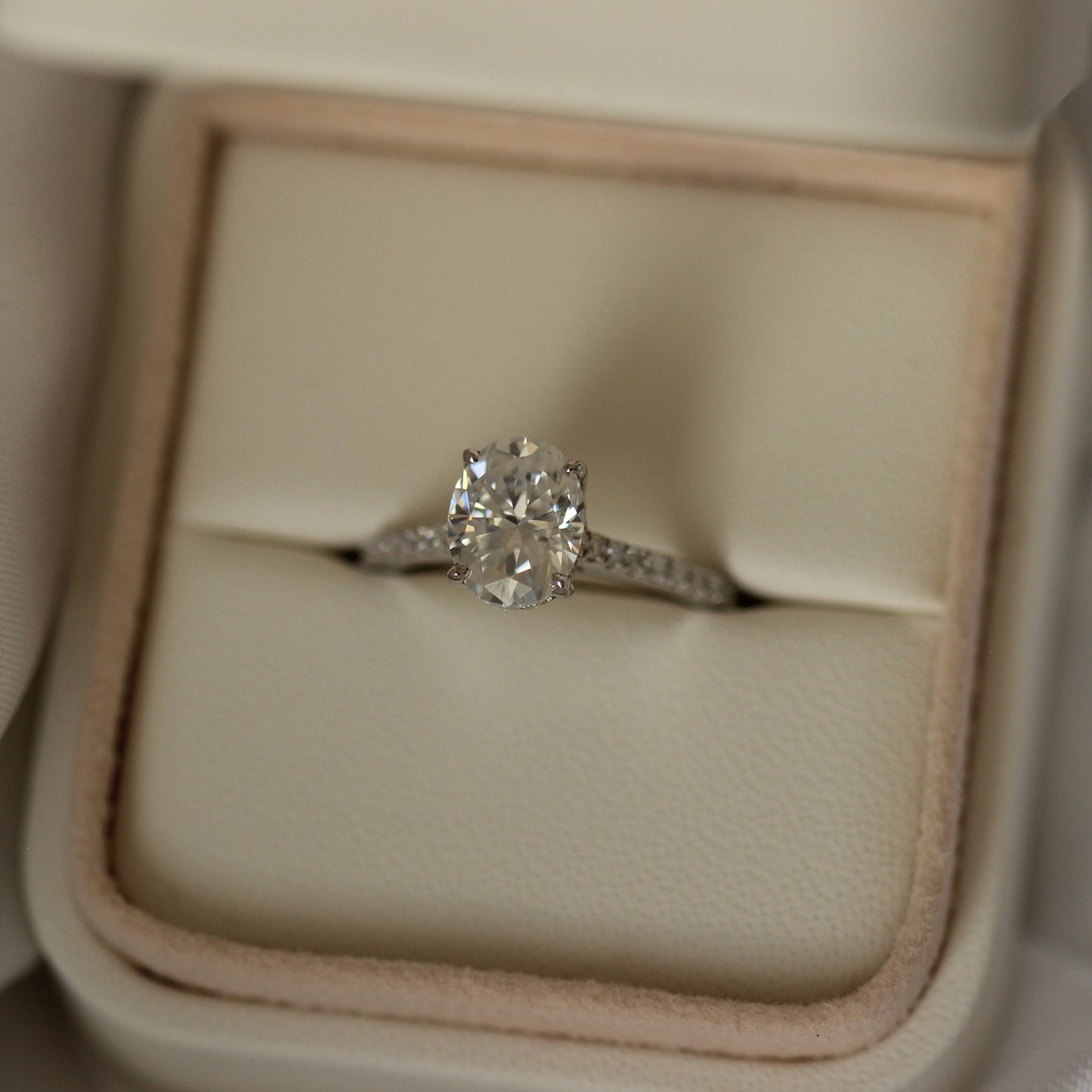 2 carat oval-cut moissanite wedding ring with pavé band