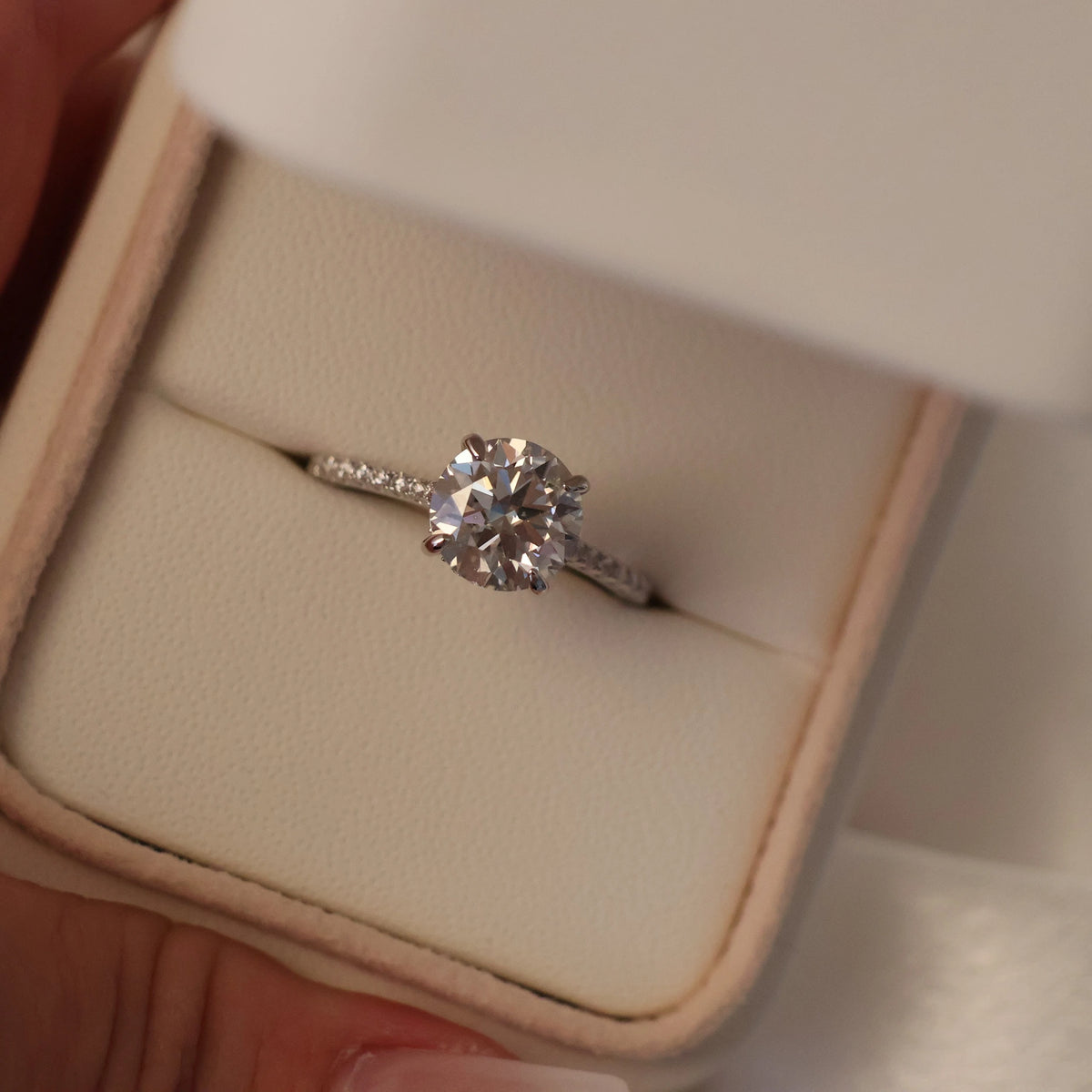 2 carat round cut moissanite ring with pave band
