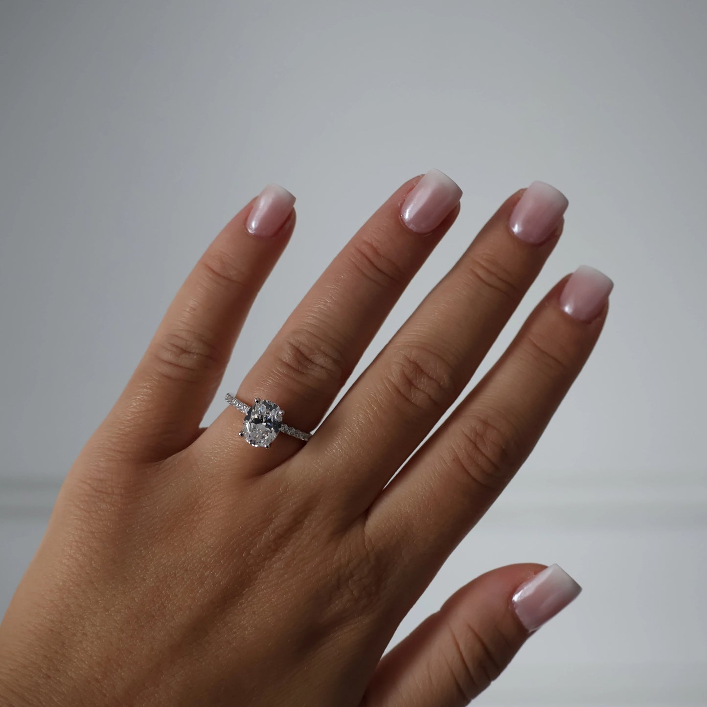 2 carat oval cubic zirconia ring with pavé band in silver