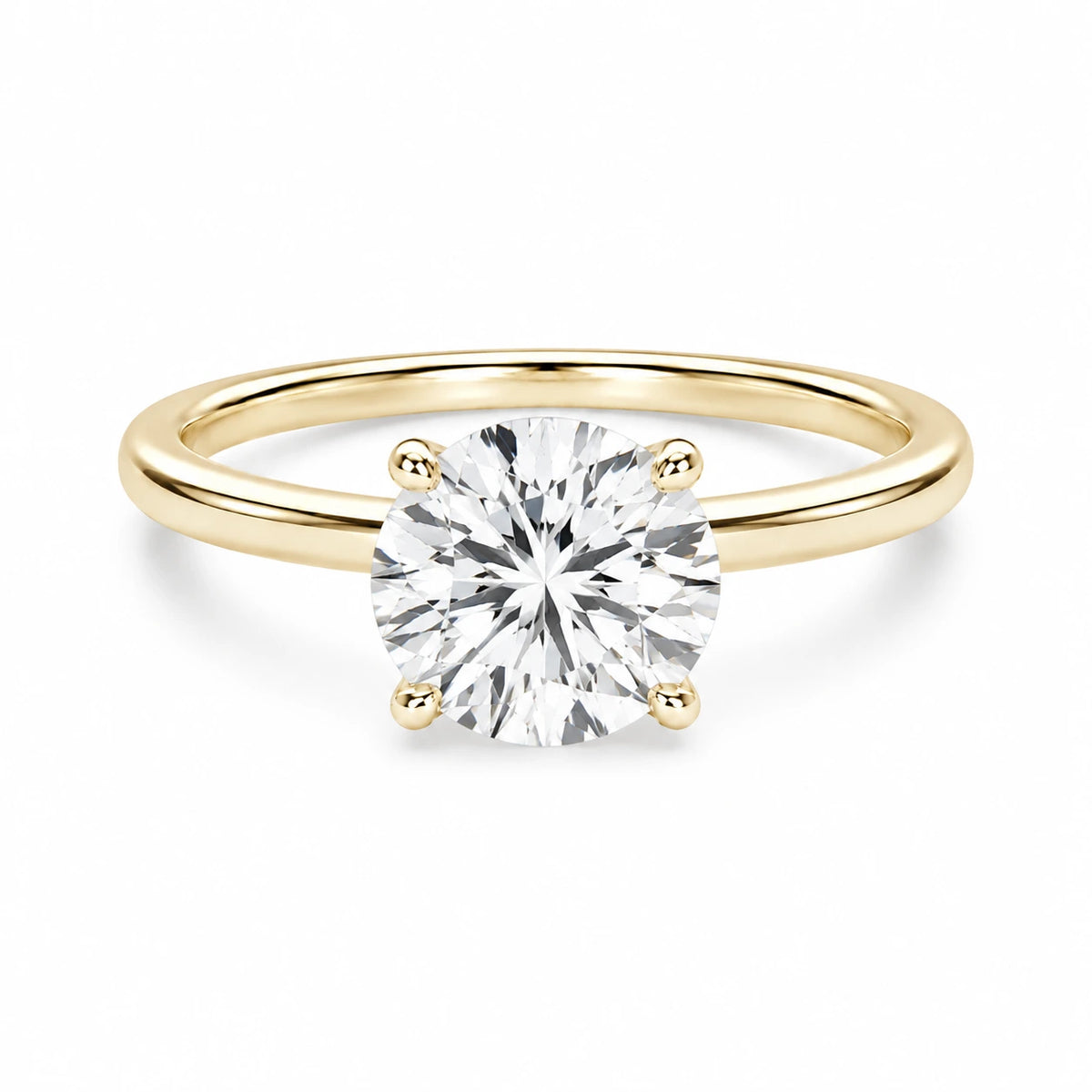 2 ct round gold engagement ring on white background
