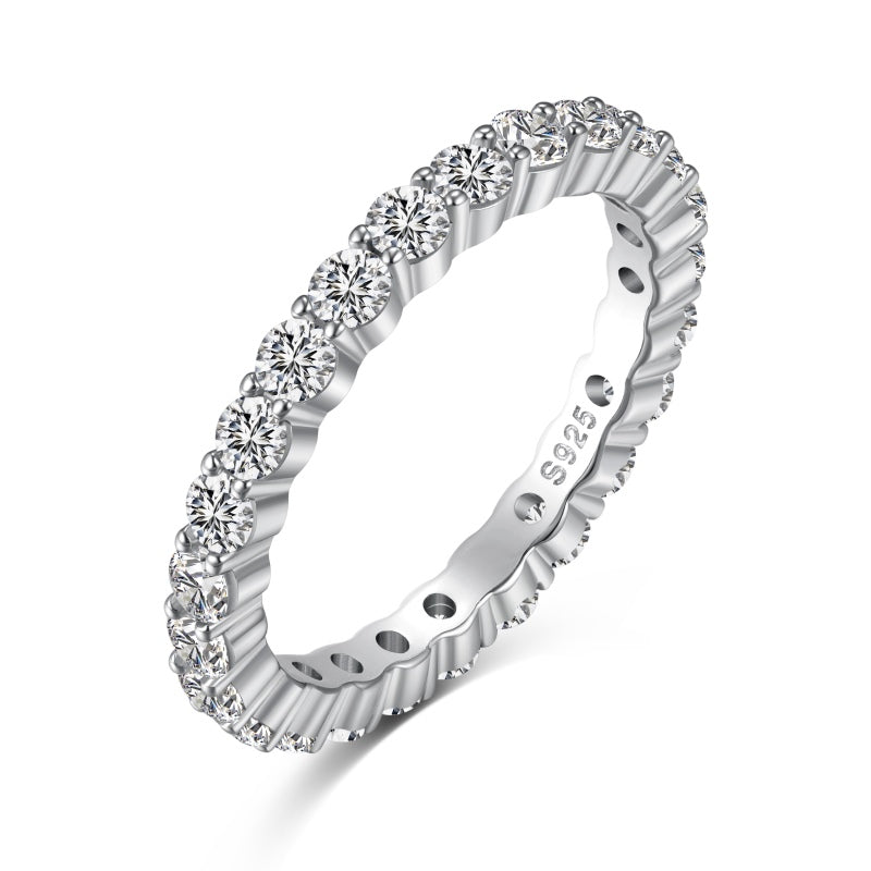 2mm silver eternity band with solitaire stones shown at a diagonal angle on a white background