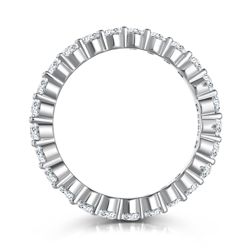 2mm silver eternity band with solitaire stones standing upright on its side on a white background