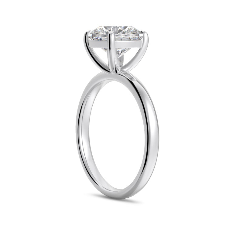 3 carat round cut silver ring side view on white background