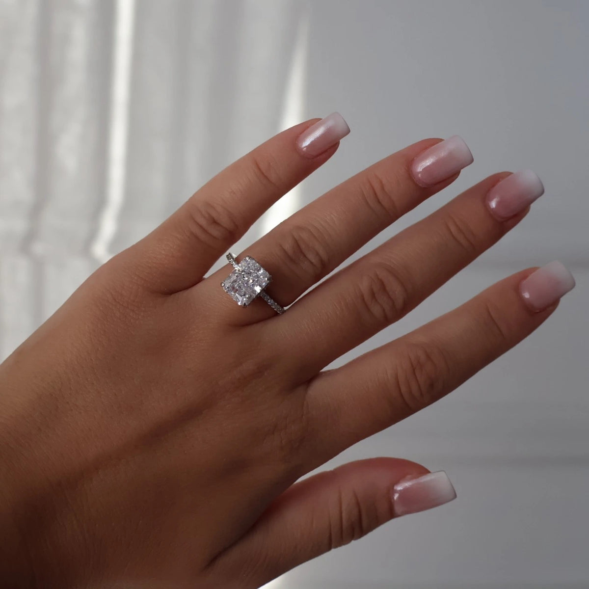 3.5 carat radiant cut CZ ring with pavé band