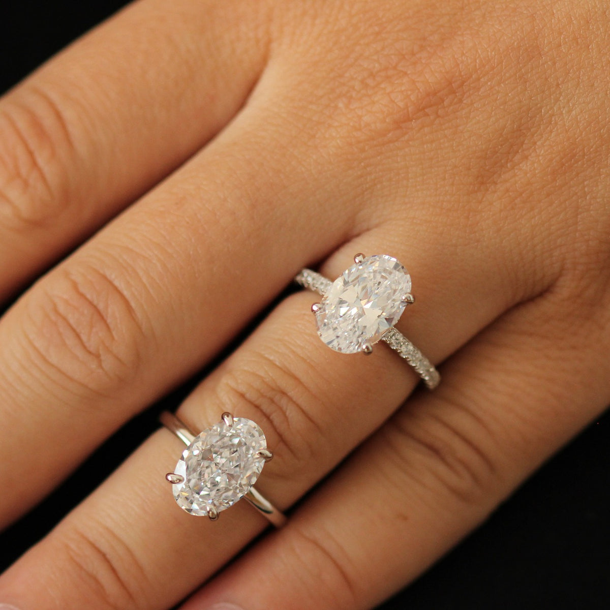 two 3.5 carat cubic zirconia oval rings on hand