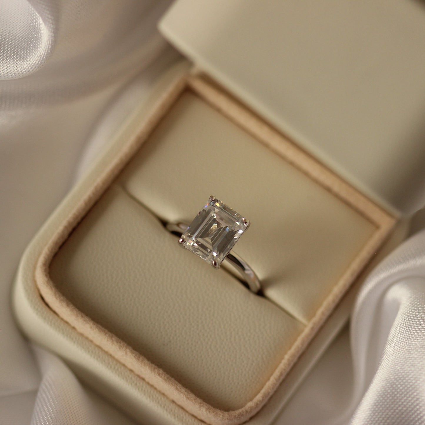 4 carat emerald cut engagement ring in proposal box