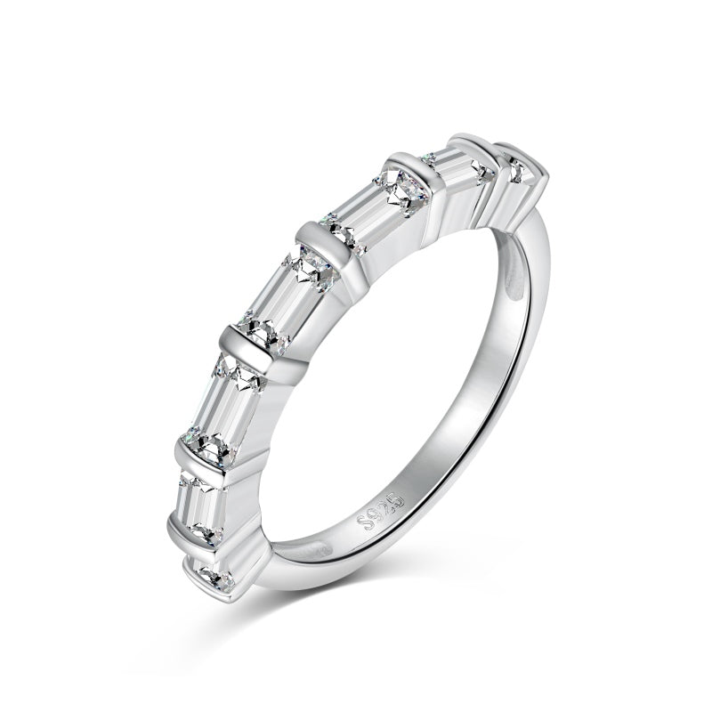 Silver ring with baguette-cut diamonds on a white background