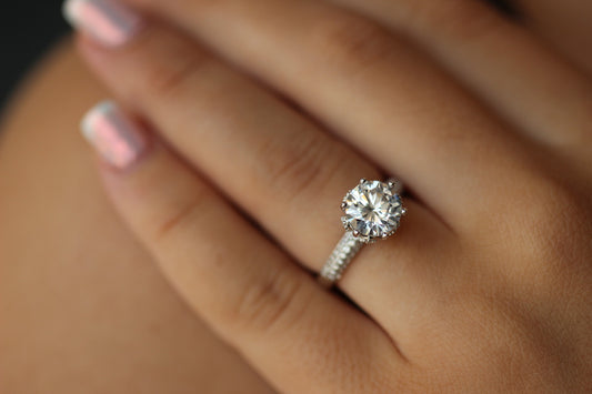 round stone on silver band with tiny cz stones on it