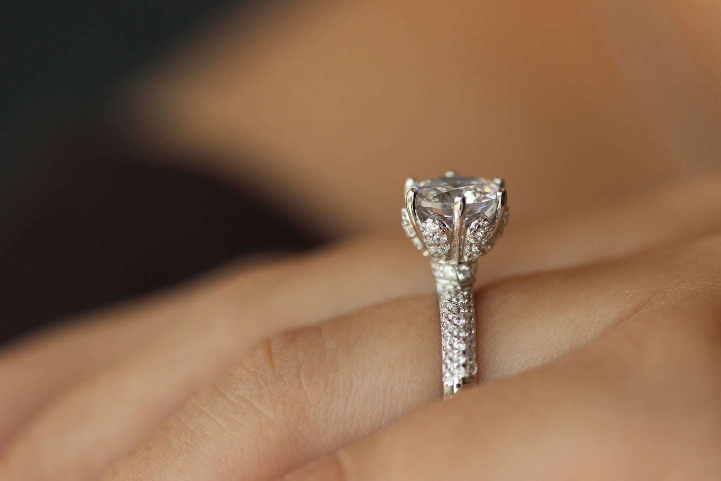 round stone on silver band with tiny cz stones on it
