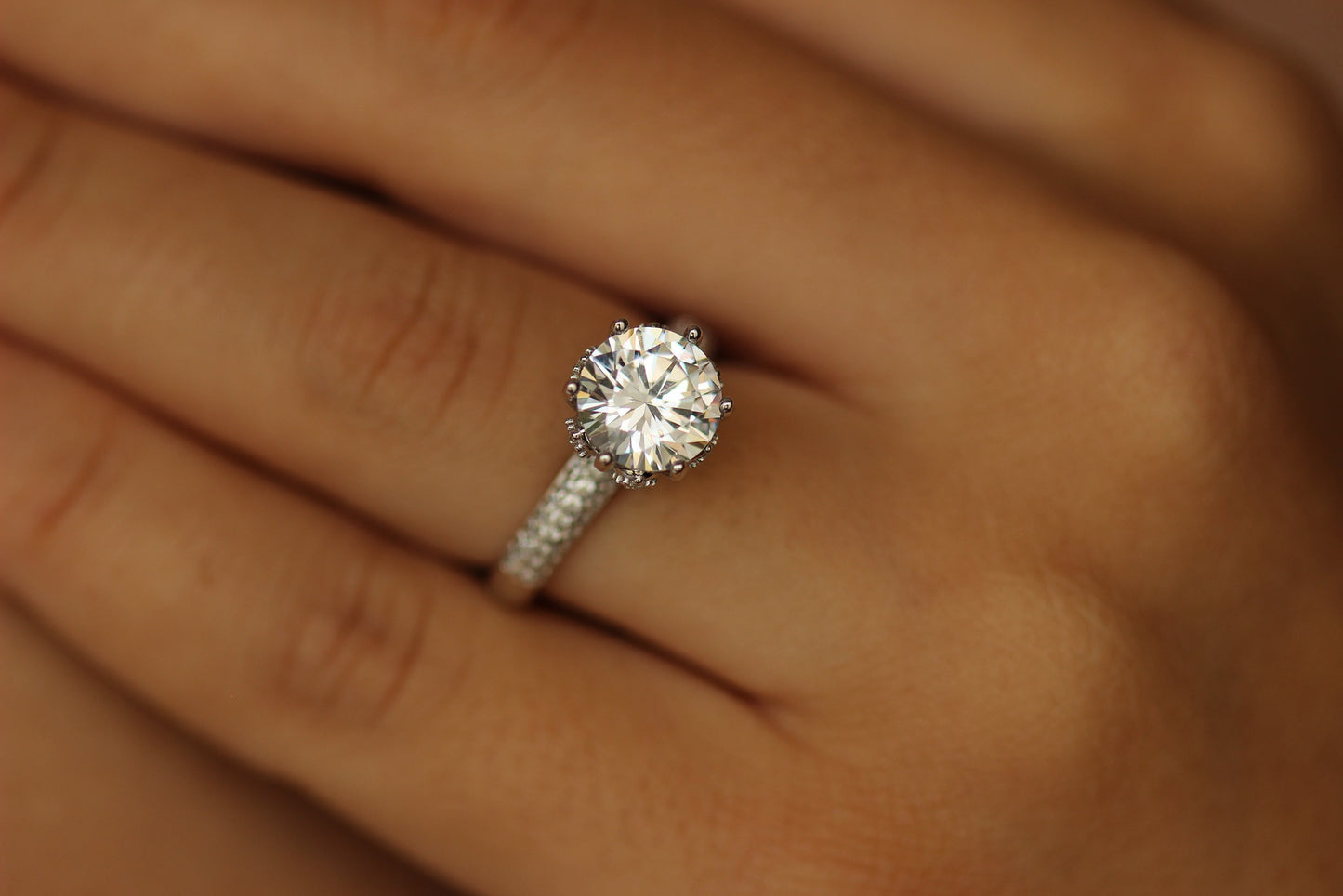 round stone on silver band with tiny cz stones on it