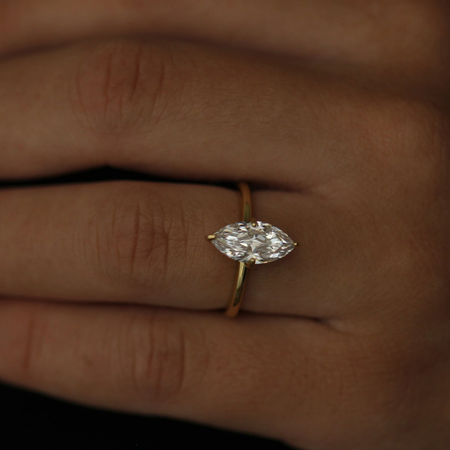 Marquise cut cubic zirconia solitaire ring in gold