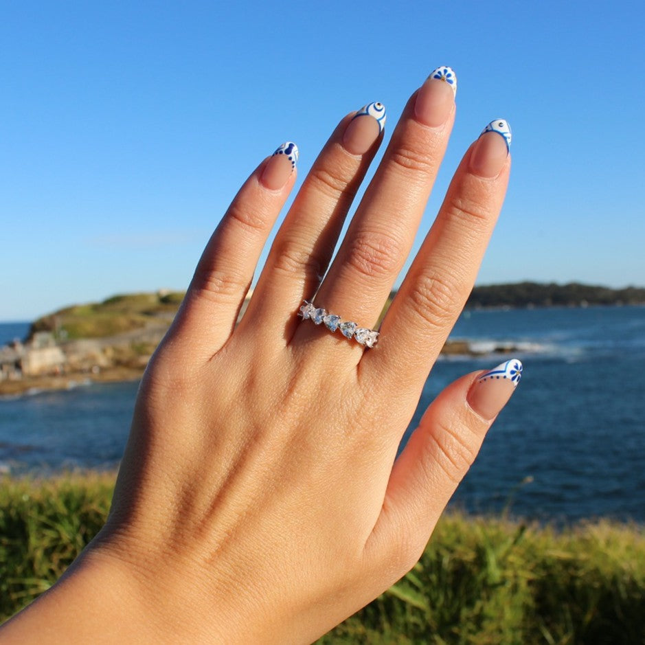 Dakota statement cubic zirconia ring on hand at La Perouse Beach, Sydney