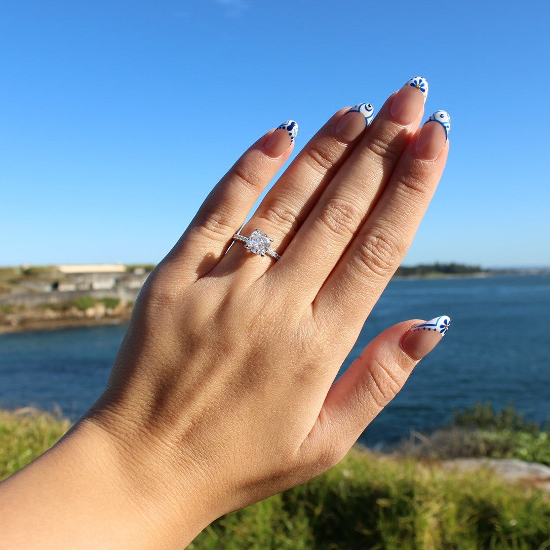 Florence cushion cut ring on hand at La Perouse Beach, Sydney