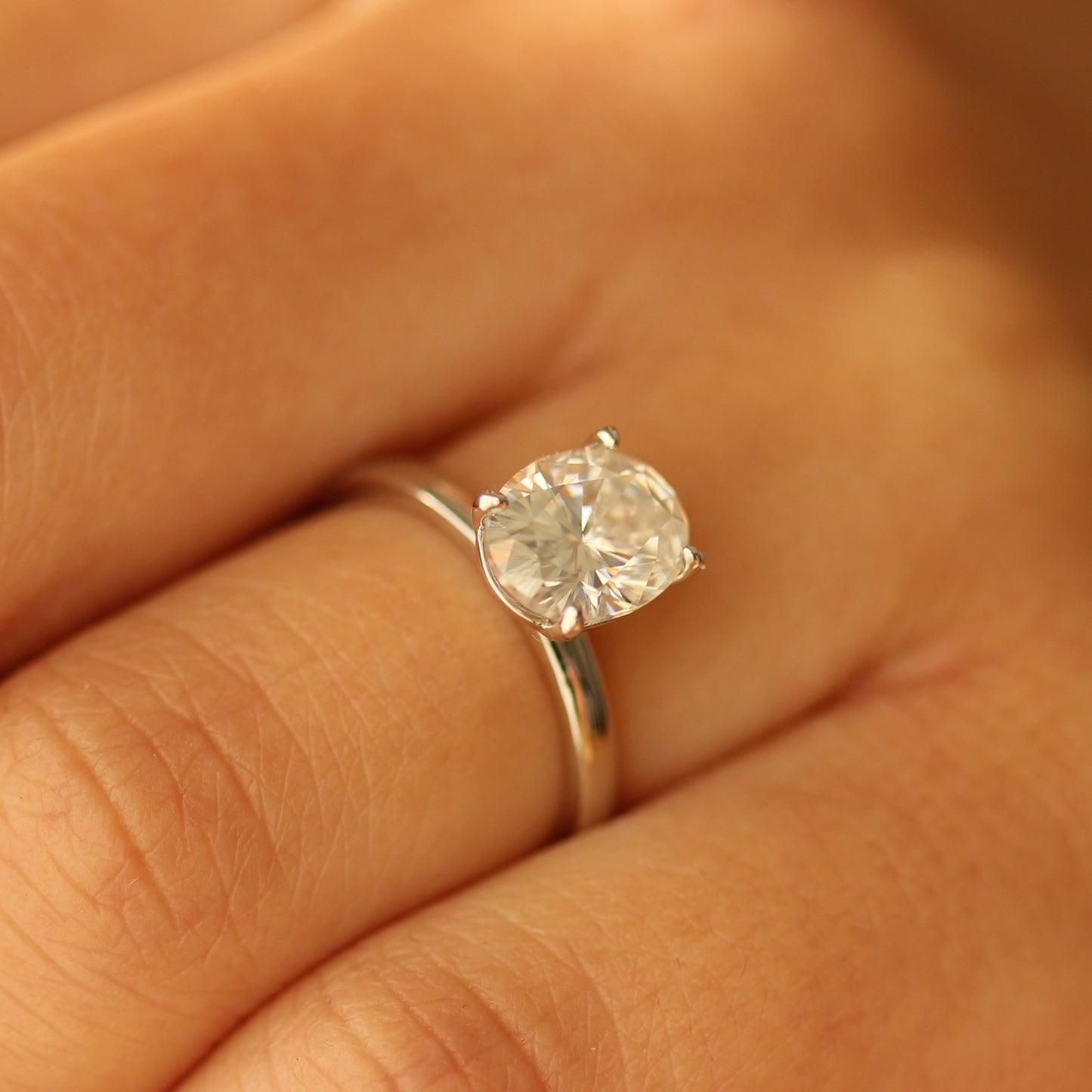2ct oval moissanite ring on hand