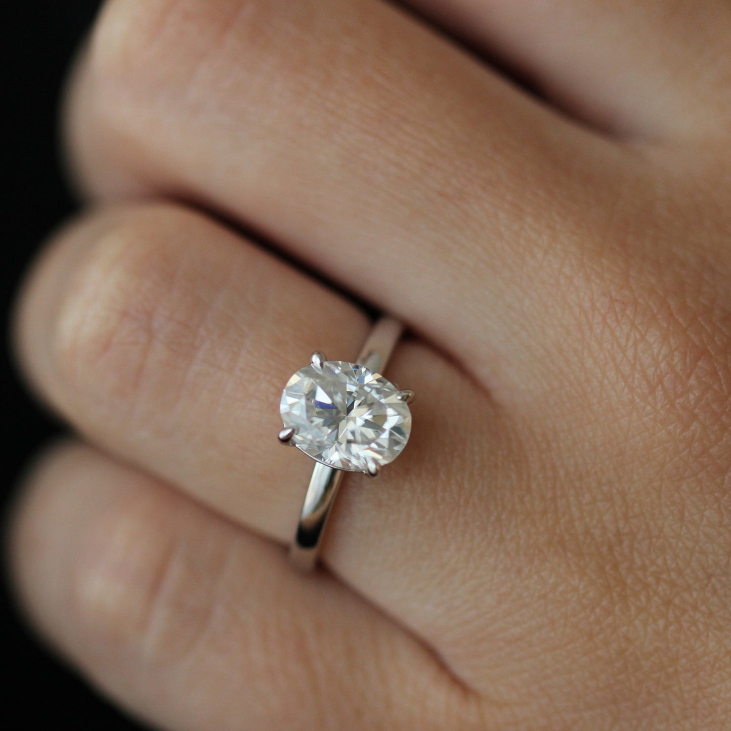 2ct oval moissanite ring on hand