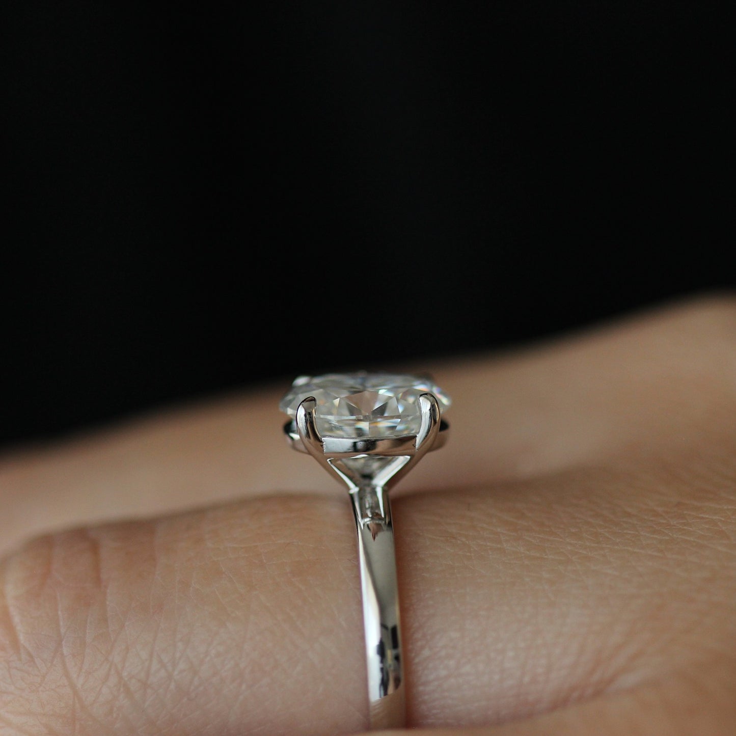 Side view of 2ct oval moissanite ring