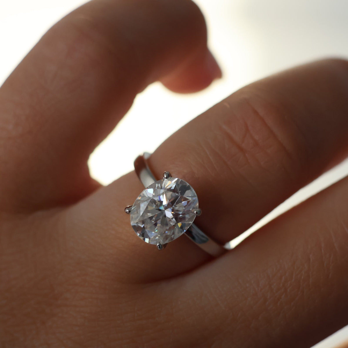 3ct oval moissanite ring on hand
