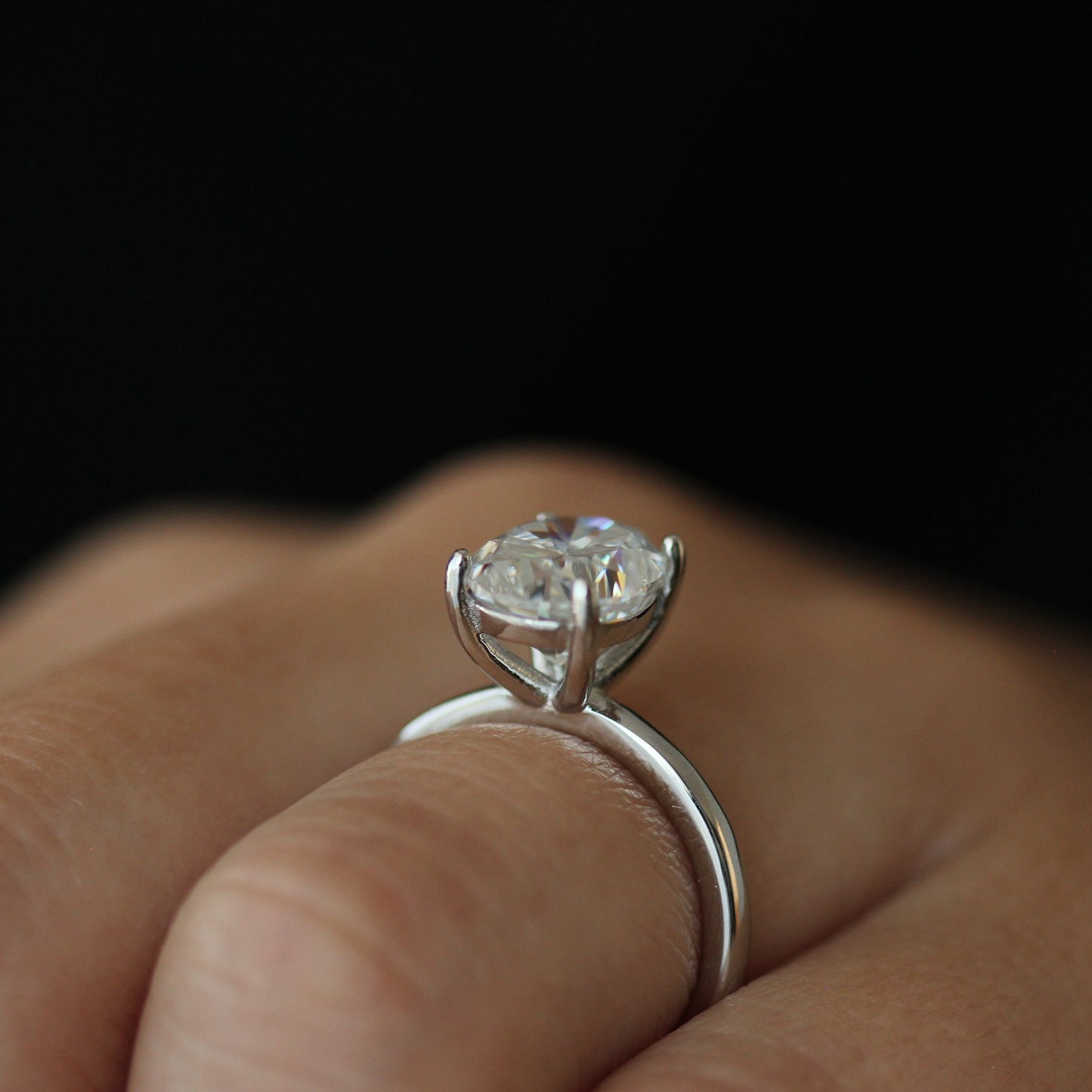 Side view of 3ct oval moissanite ring