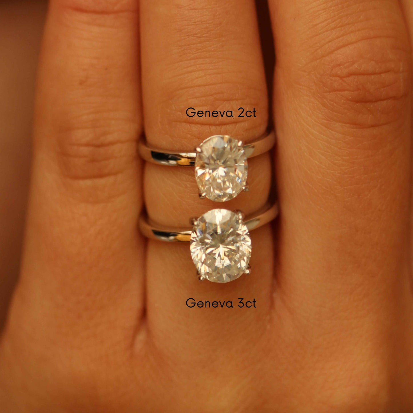 3ct oval moissanite ring and 2ct oval moissanite ring on hand