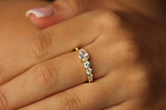 Gold statement ring on hand