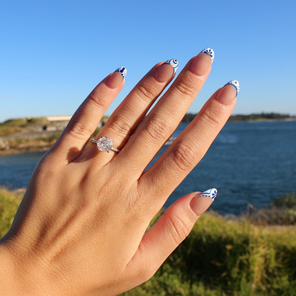 London round ring on hand at La Perouse Beach, Sydney