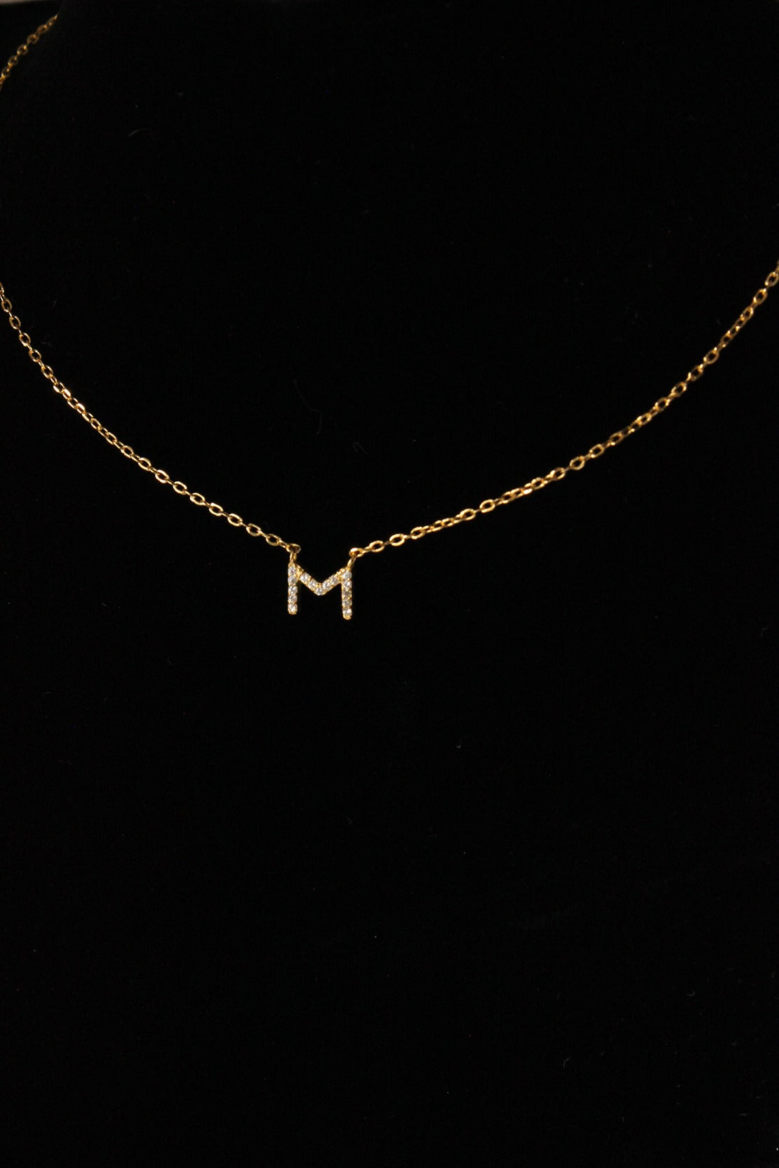 gold chain with letter m