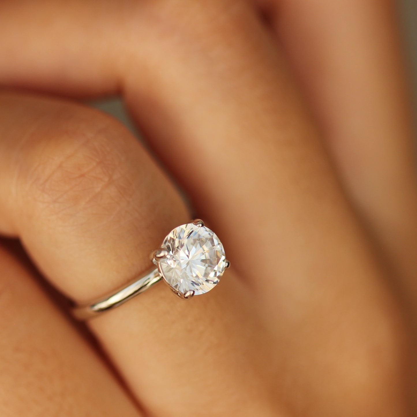 Madeira 2 Ct Round Cut Ring with high-quality cubic zirconia on hand