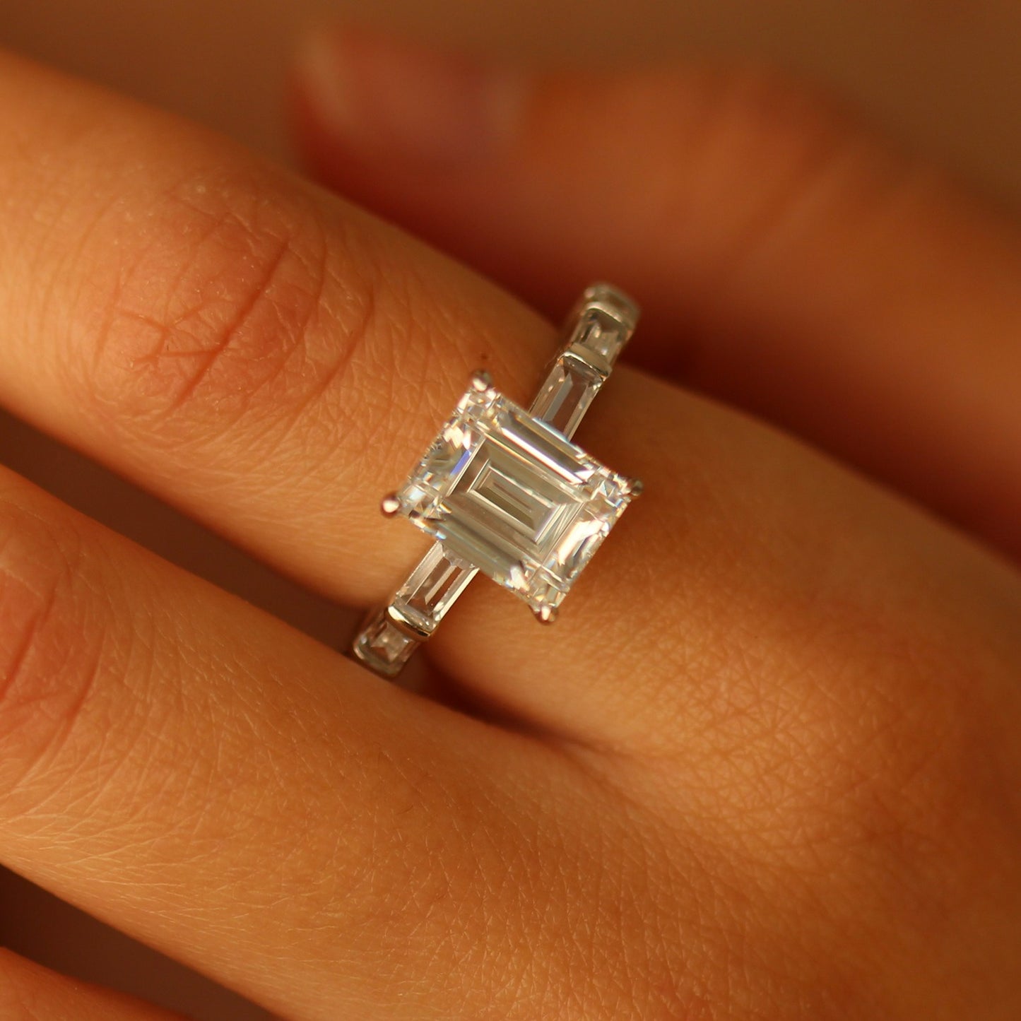 Miami emerald cut ring on hand