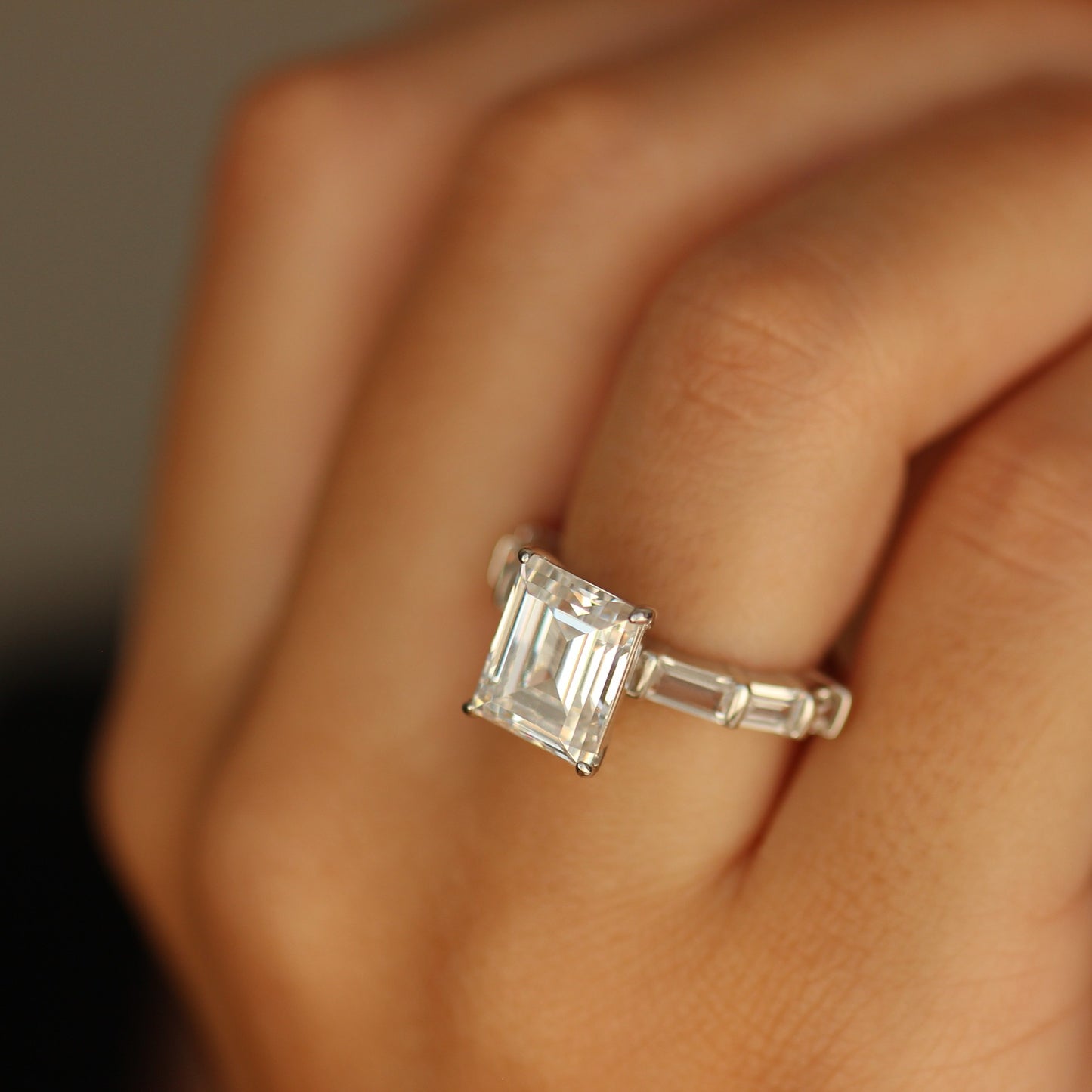 Emerald cut cubic zirconia ring on hand
