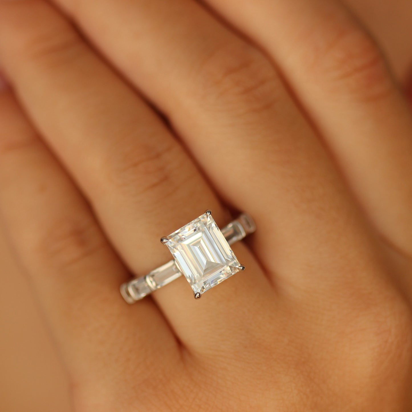 Emerald cut cubic zirconia ring on hand