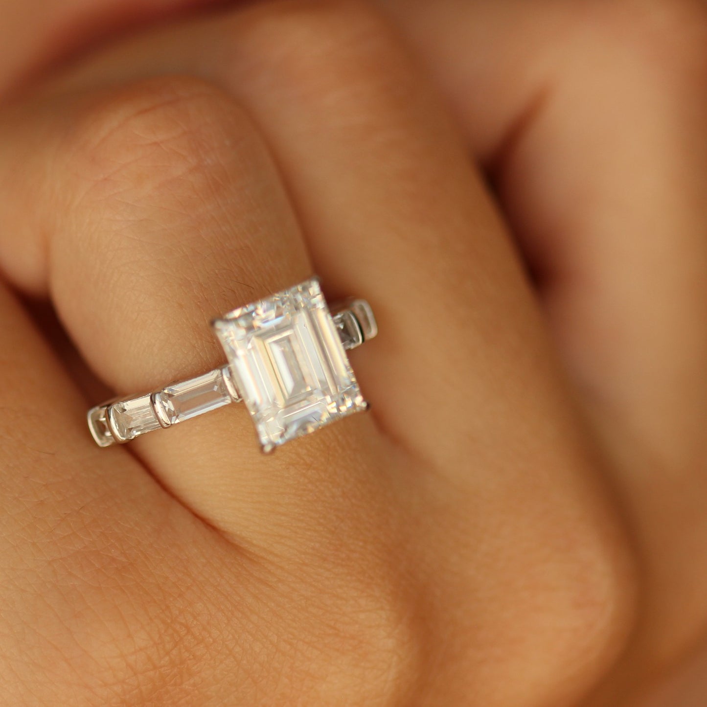 Emerald cut cubic zirconia ring on hand