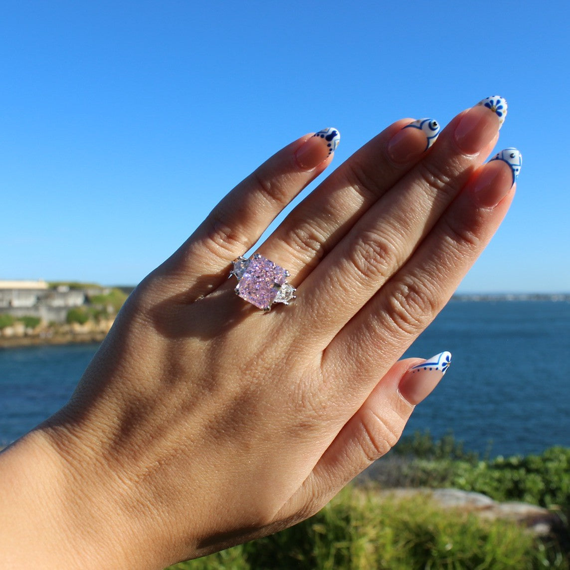 Osaka pink ring on hand at La Perouse Beach, Sydney