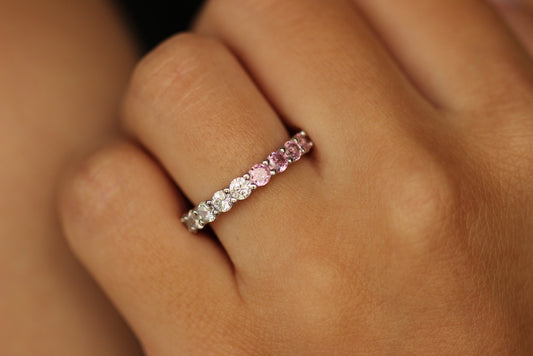 Pink stacker ring on hand