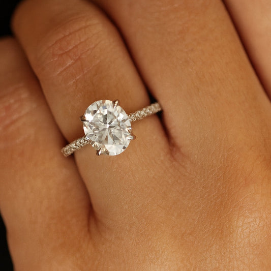 3 carat oval moissanite ring with pave band on hand