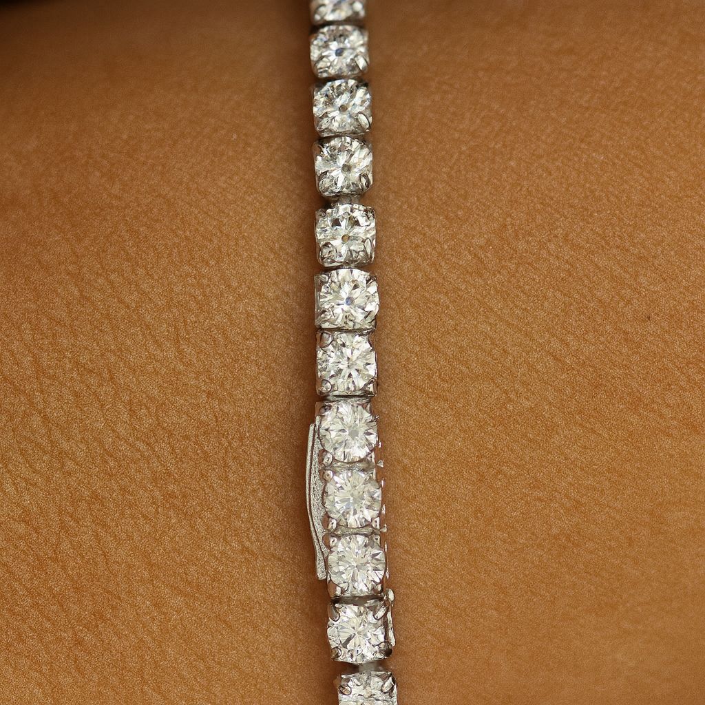 3mm silver tennis bracelet on wrist, up close shot of clasp