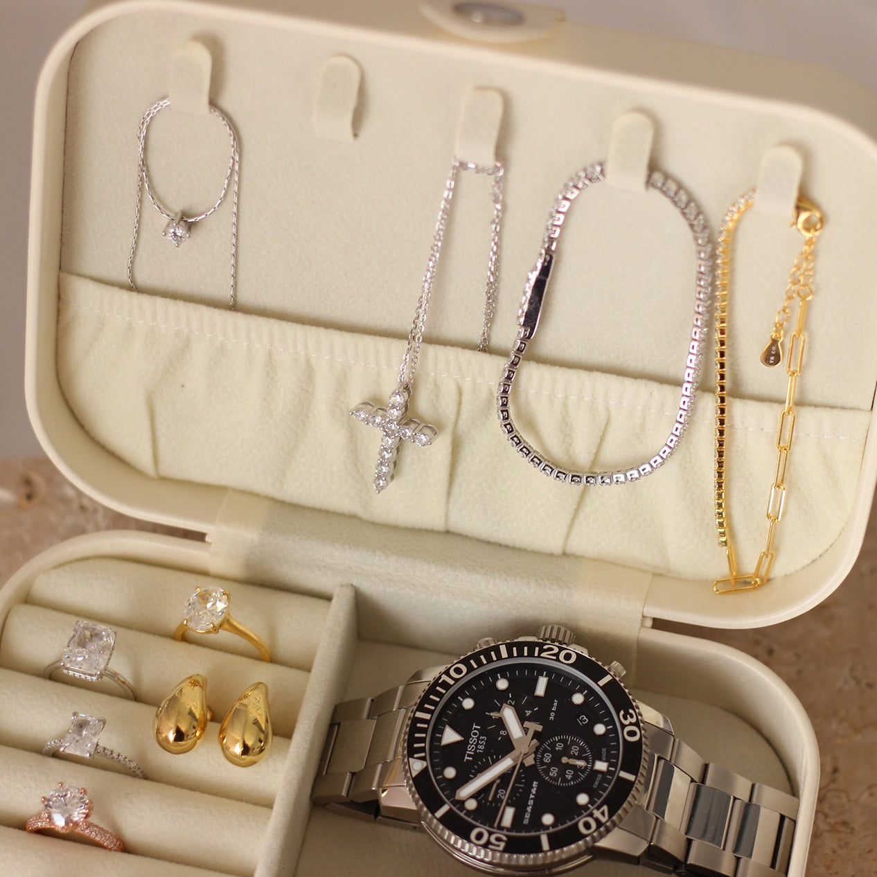 Travel jewellery case with cubic zirconia jewellery inside, Tissot watch and Vivienne Westwood watch