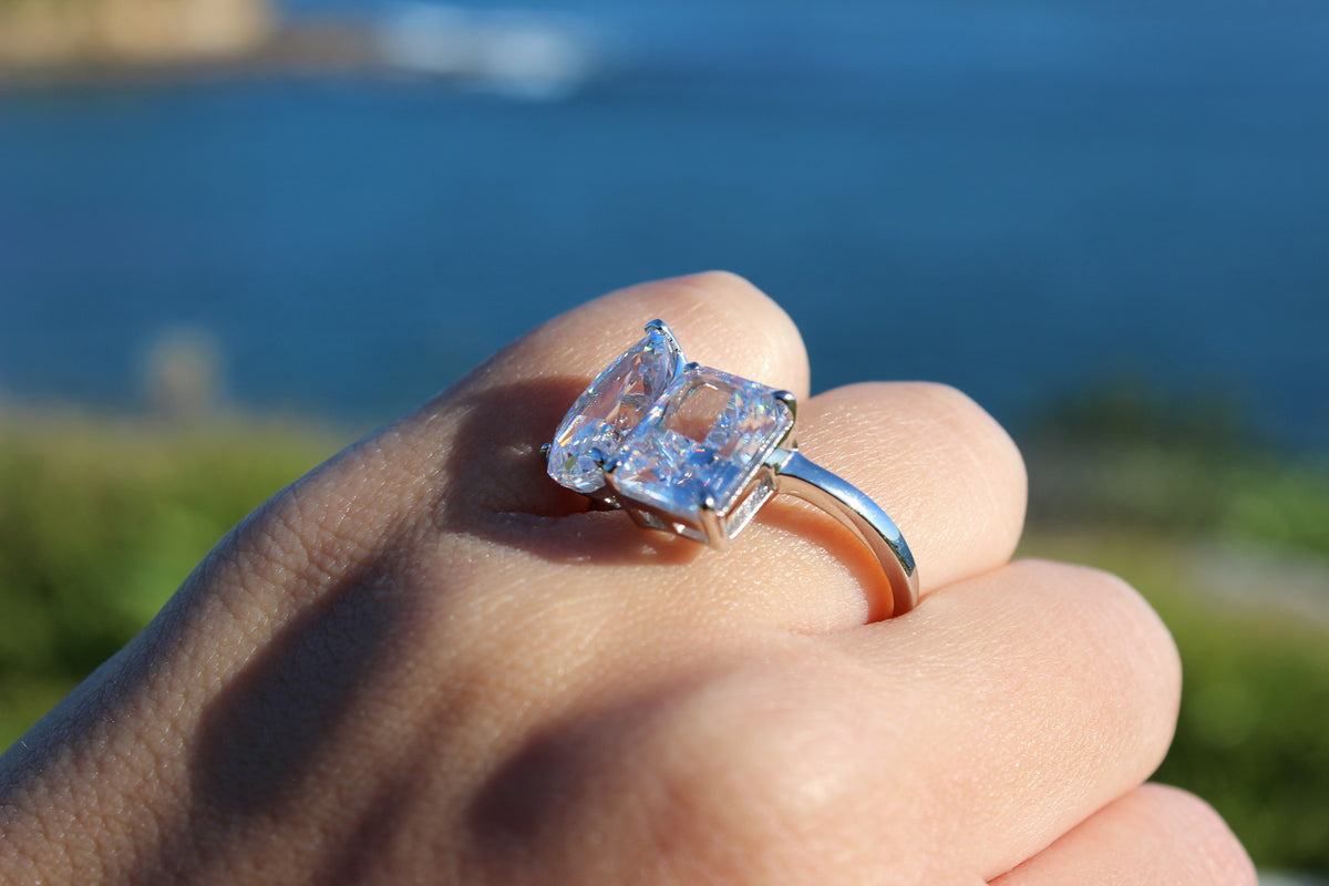 silver toi et moi ring with pear and rectangle stone