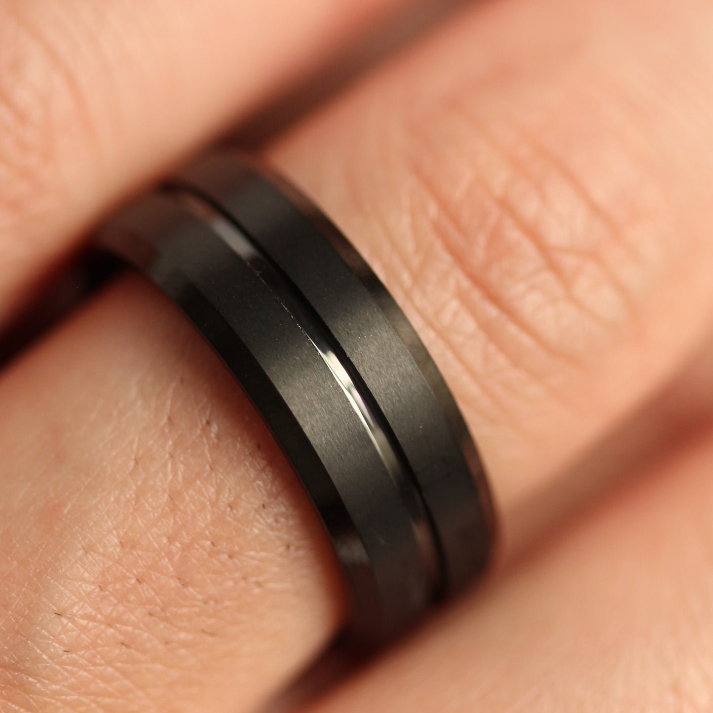black men's ring on hand