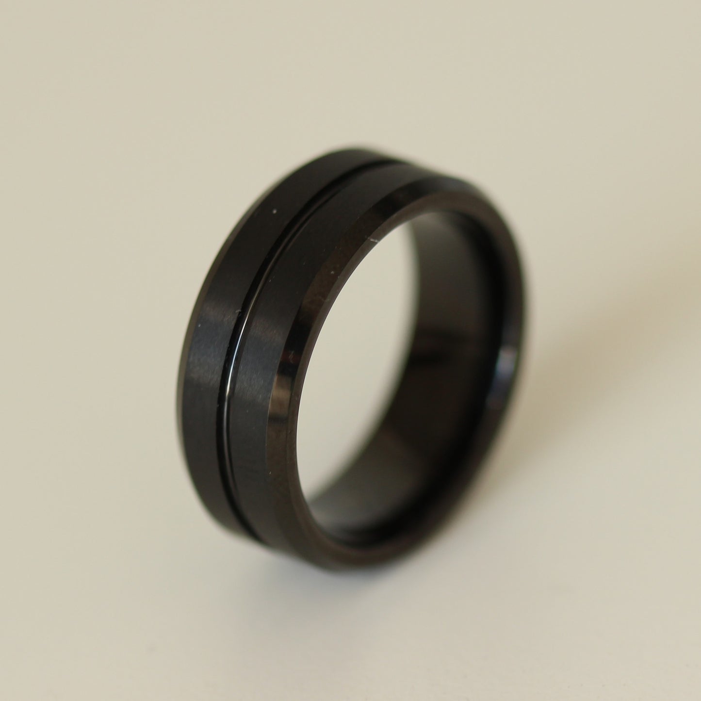 black men's ring on white background