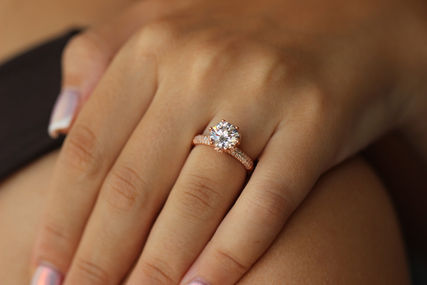 rose gold ring with round stone centre with cubic zirconia stones on band