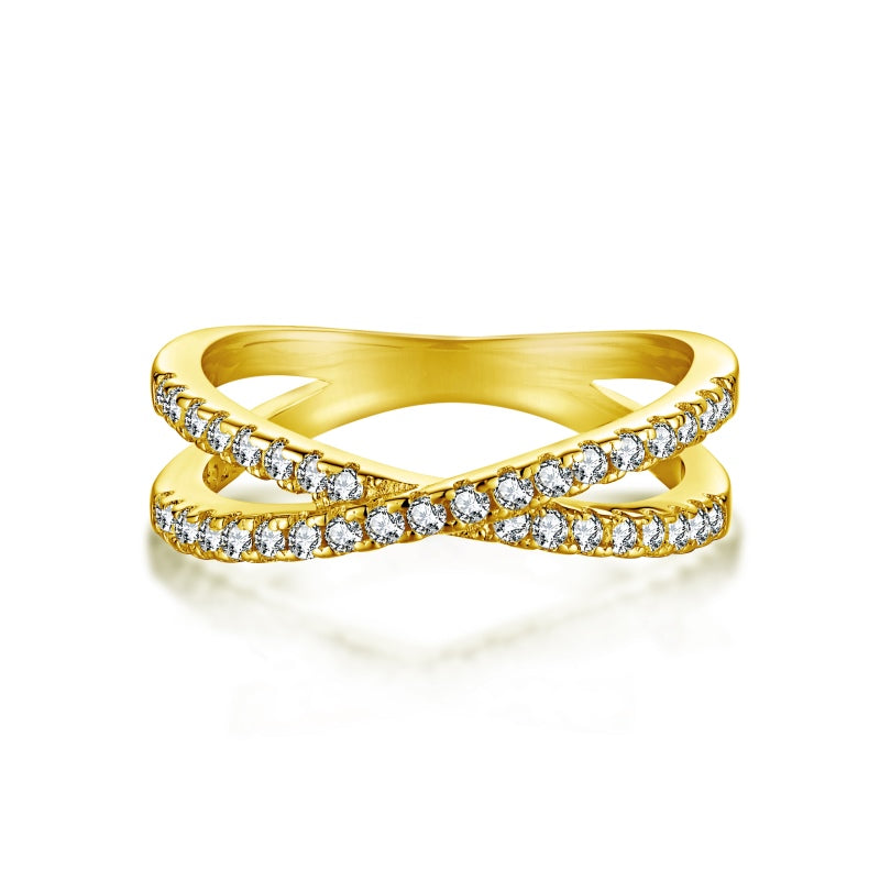 Criss cross gold ring with round cz stones on white background