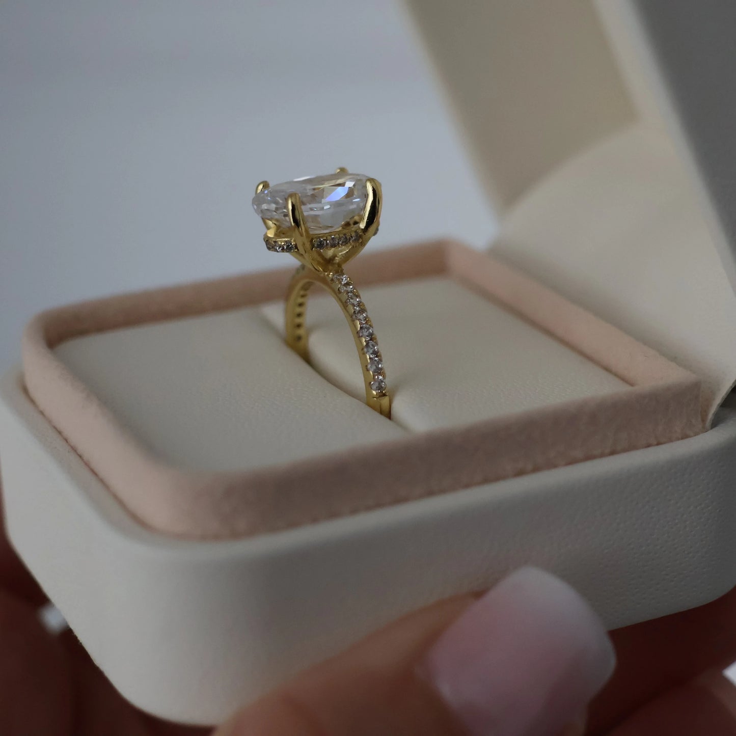 14k gold crushed ice oval engagement ring in proposal box