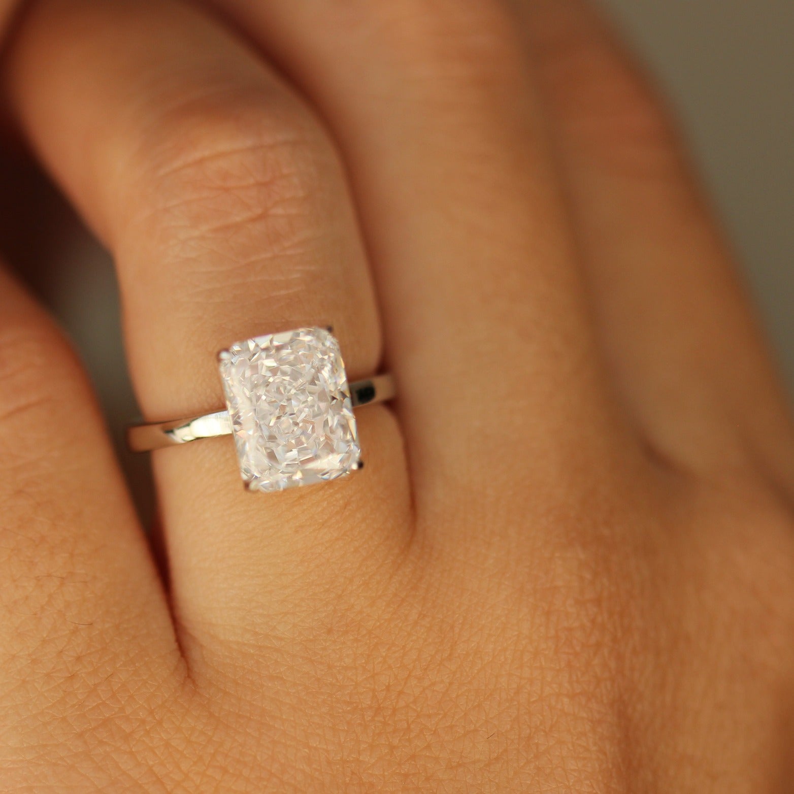 dubai 4 carat radiant cut engagement ring on hand