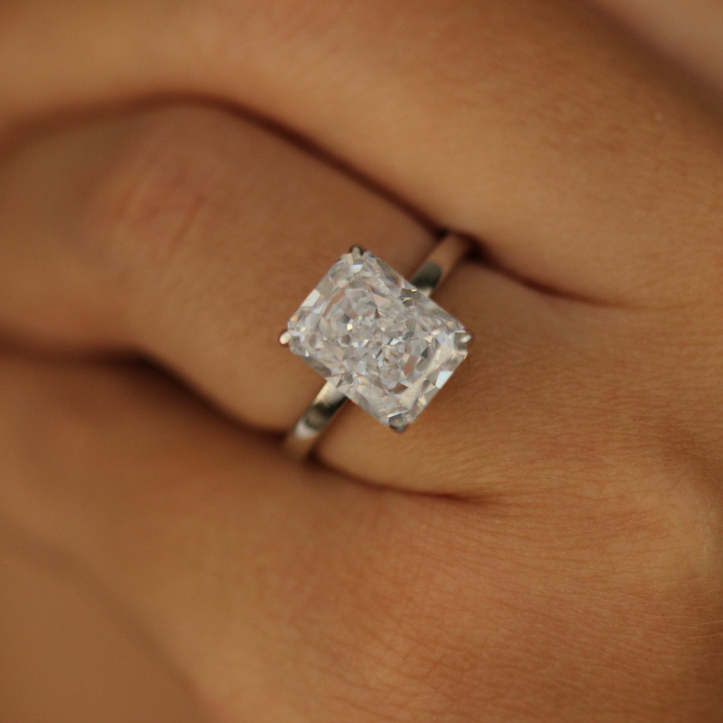 dubai radiant cut engagement ring on hand